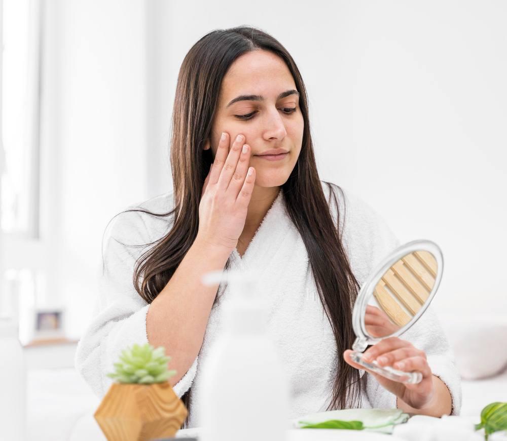 Woman looking at mirror