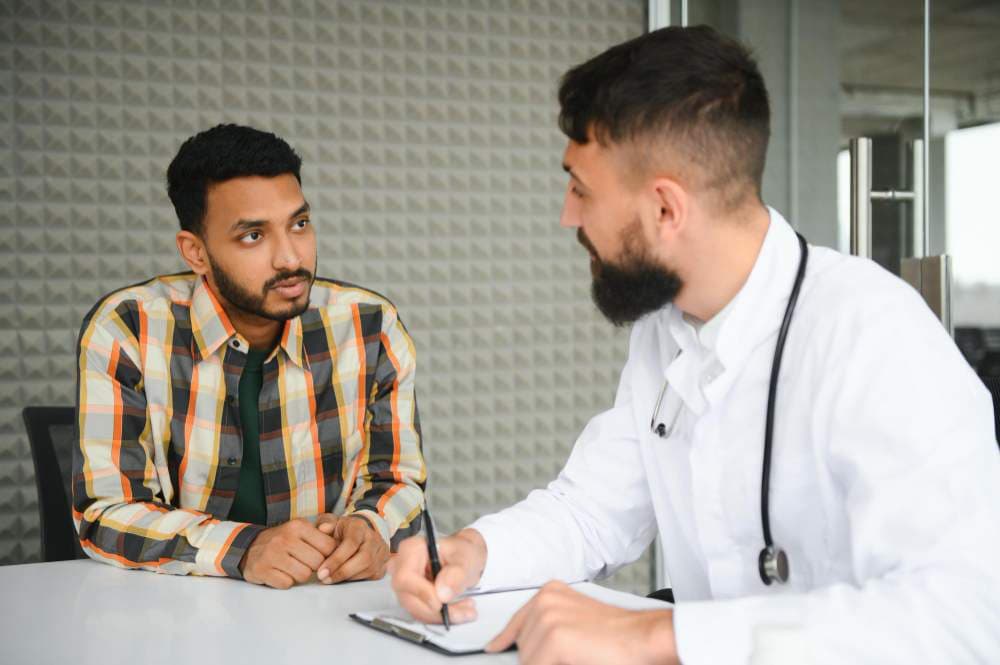 male patient discussing with doctor