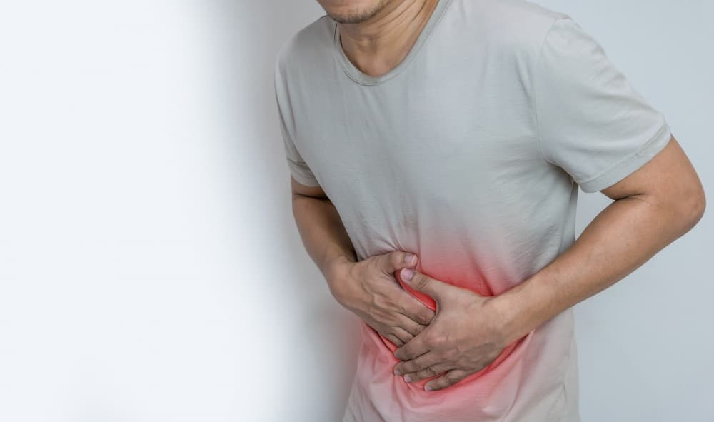 man suffering from stomach ache