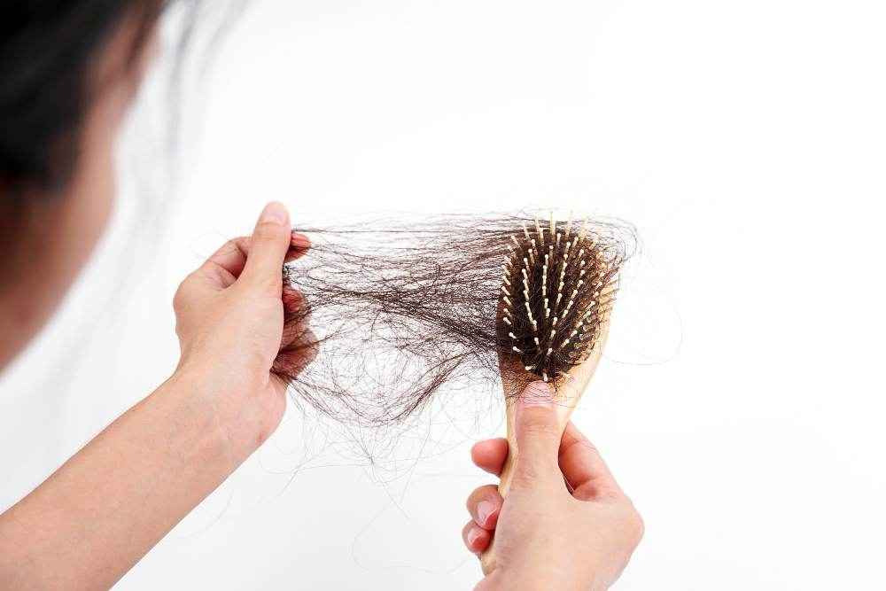 Hair Fall In Monsoon: Causes & Prevention Tips